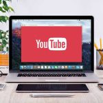 Trump Authorizes Private Companies to ‘Hack Back’ at Cybercriminals YouTube logo on a laptop screen on desk.