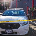 Police Seize 2,400 Stolen Catalytic Converters Worth $4.3M Police car behind yellow caution tape on a city street