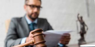 Close-up of a wooden judge’s gavel on a desk