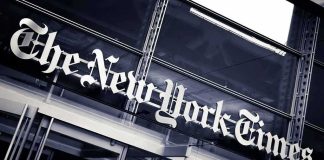 Slain NYT Exec’s Family Fight Takes Dark Turn The New York Times sign on a glass building facade