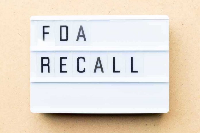Lightbox sign reading FDA recall on beige background