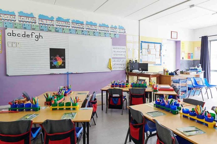 Elementary classroom with arranged desks and colorful supplies