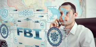 Man on phone behind digital interface with FBI and cybersecurity graphics