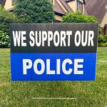 Yard sign supporting police on a lawn