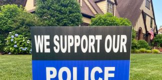 Yard sign supporting police on a lawn