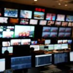 control room with multiple screens and monitors