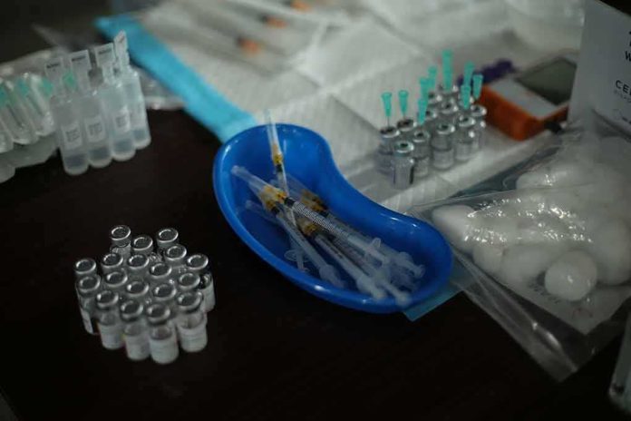 Medical syringes and vials arranged on a table