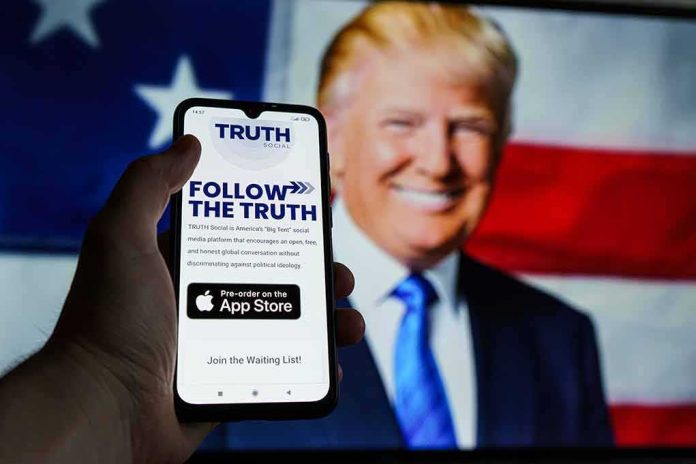 Smartphone showing Truth Social app screen with Donald Trump on a U.S. flag backdrop