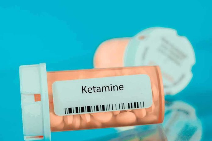 Prescription pill bottle labeled ketamine on a blue background
