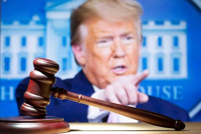shutterstock_2283594093 judge’s gavel with a blurred person pointing in the background