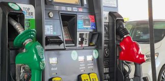 Gas pump with green diesel and red gasoline nozzles