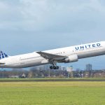 United Airlines jet taking off from runway