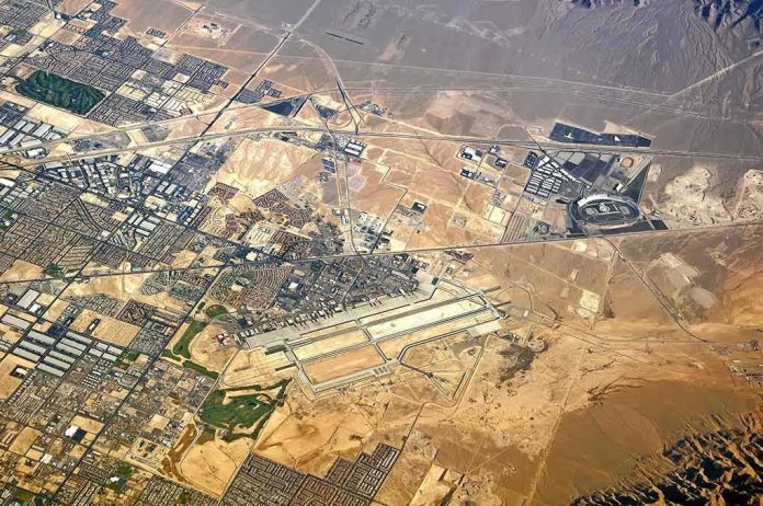 shutterstock_473809174 Aerial view of desert city with airport and highways