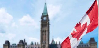 Canadian flag with Parliament building in background