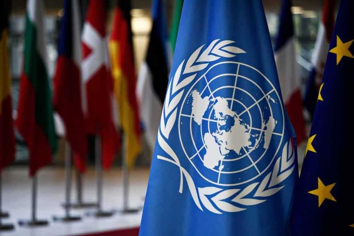 shutterstock_1091235857 United Nations flag among international flags