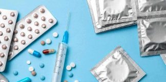 Contraceptives and medications on blue background