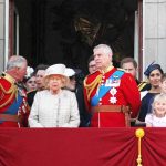 Elizabeth II with Charles, Prince of Wales, and Prince Andrew on balcony; Meghan, Duchess of Sussex, and Prince Harry nearby