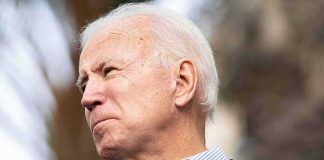 older man speaking into a microphone