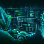 Hacker in hoodie using laptop with digital virus graphics