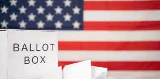 Skid Row Ballots Reportedly Left WIDE OPEN Ballot box with papers in front of an American flag