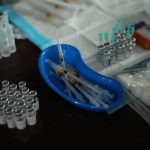Medical syringes and vials arranged on a table