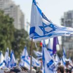 Israeli flags waved at a street demonstration