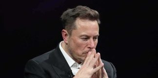 ‘Elon Musk THRIVES on Chaos’ Source Says Elon Musk seated with hands steepled in thought